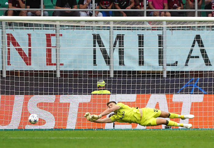 Goalkeeper Nick Pope pictured making one of EIGHT saves during Newcastle's 0-0 draw at AC Milan in the UEFA Champions League in September 2023